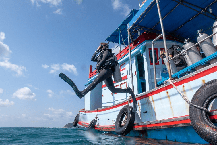 Giant stride entry from boat in Thailand