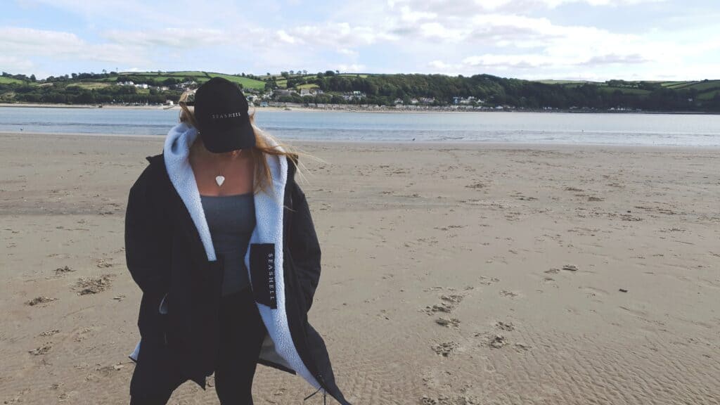 Seashell changing robe on beach