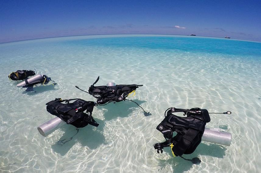 Scuba kit floating in clear water