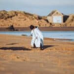 child-on-beach-in-seashell-robe