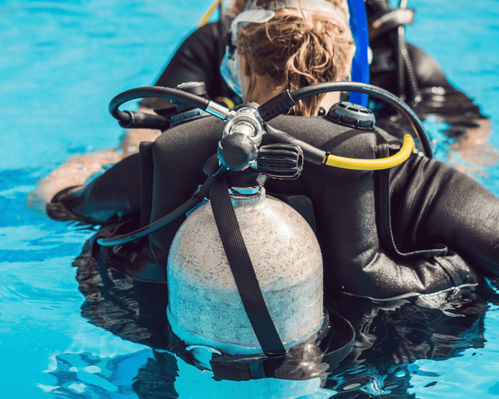 rear view of scuba tank attached to BCD in pool