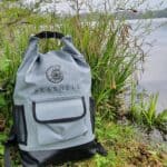 Seashell drybag front by water and grass