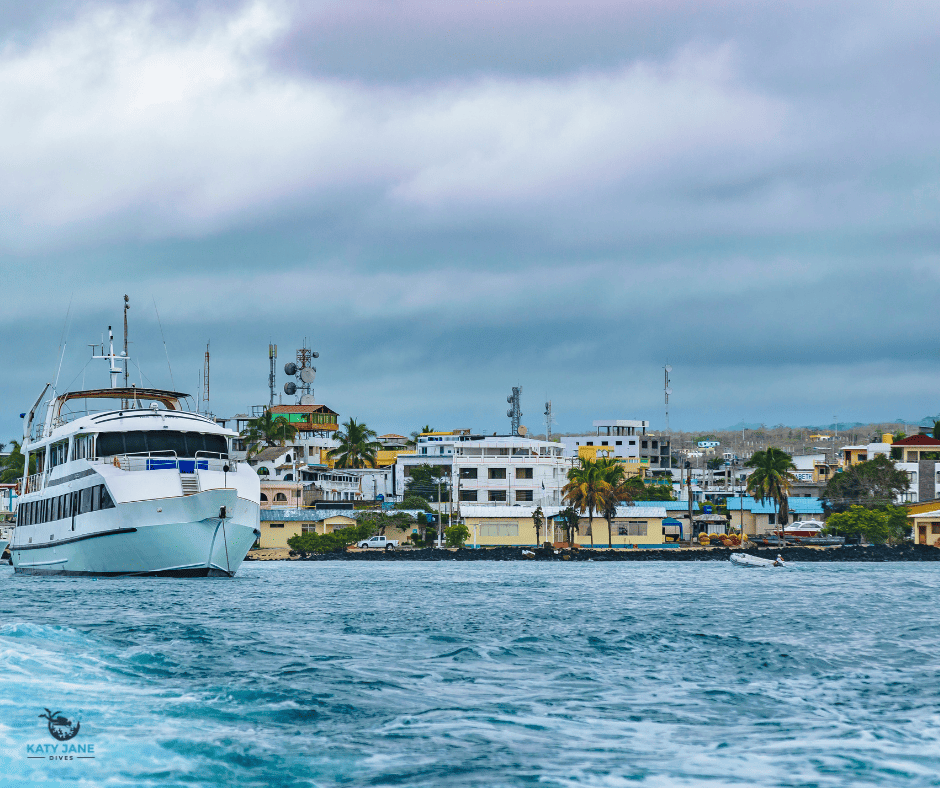 water and boats with coastal village in background